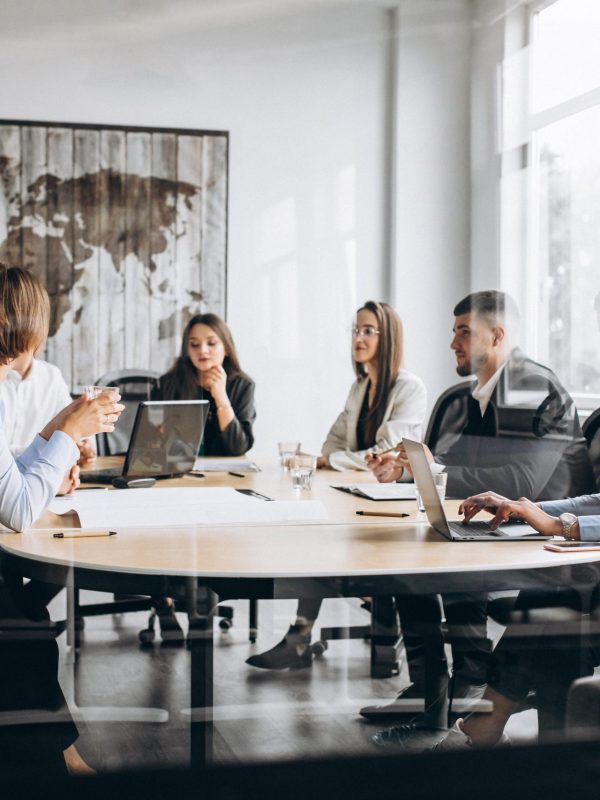 Group of people working out business plan in an office